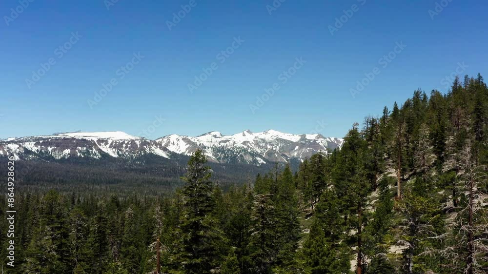 Snow-capped Sierra Nevada mountains under clear blue sky Snow-capped Sierra Nevada mountains under clear blue sky