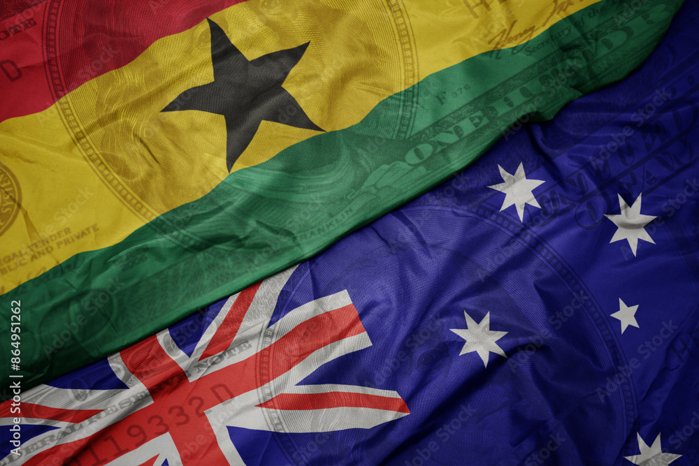 waving colorful flag of ghana and national flag of australia on the dollar money background. finance concept. waving colorful flag of ghana and national flag of australia on the dollar money background. finance concept.