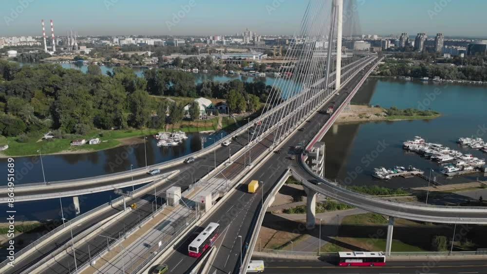 Drone view road with cars on Belgrade bridge in Serbia .View on city at sunrise over bridges Drone view road with cars on Belgrade bridge in Serbia .View on city at sunrise over bridges