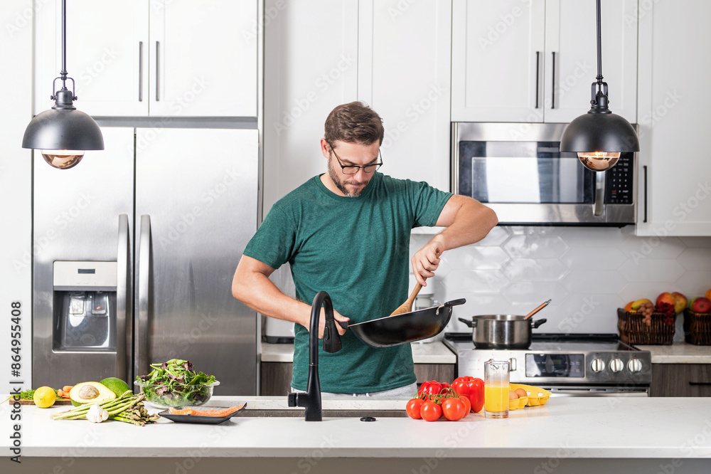Chef cook cooking with pan at kitchen. Chef cook prepares with pan. Chef cooking with pan in modern kitchen. Mature chef man hold pan standing in kitchen, preparing food. Chef cook cooking with pan at kitchen. Chef cook prepares with pan. Chef cooking with pan in modern kitchen. Mature chef man hold pan standing in kitchen, preparing food.