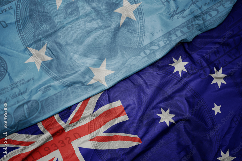 waving colorful flag of Federated States of Micronesia and national flag of australia on the dollar money background. finance concept. waving colorful flag of Federated States of Micronesia and national flag of australia on the dollar money background. finance concept.