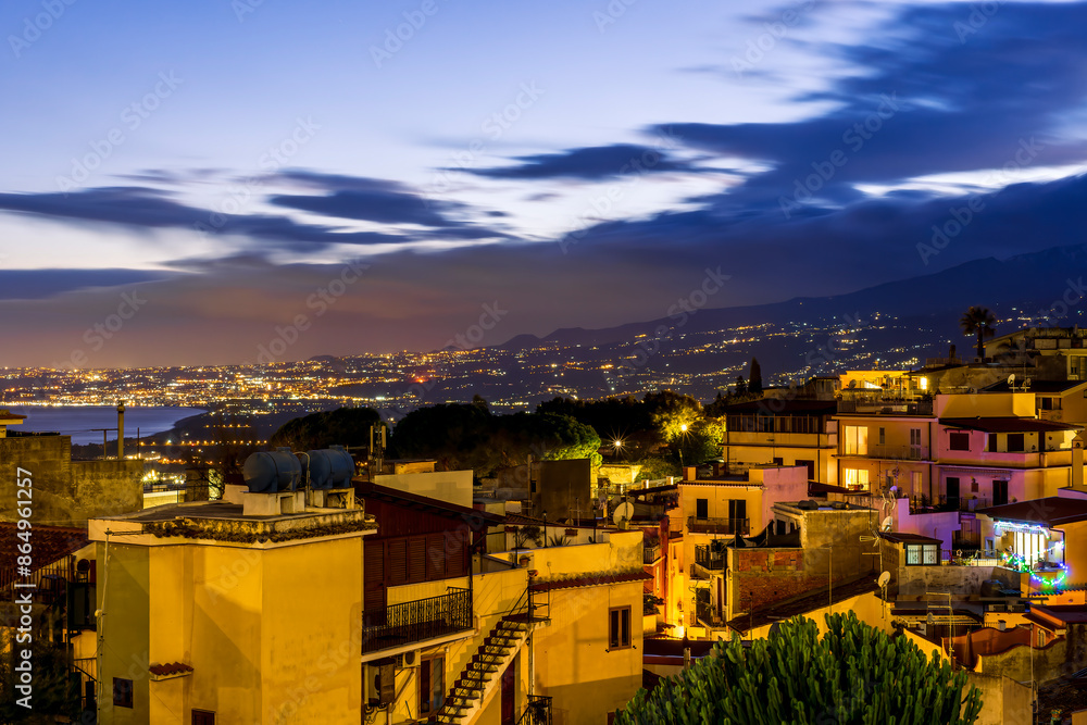 beautiful night european town in golden lights with sea shore and nice sunset sky on background beautiful night european town in golden lights with sea shore and nice sunset sky on background
