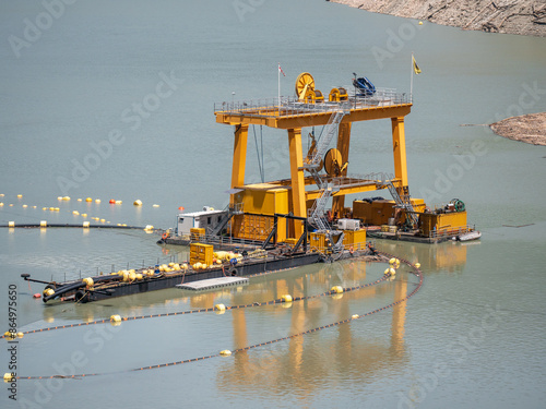 Fotografija Industrial dredging machine on water used for extracting materials from riverbed or seabed