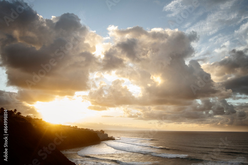 Seascape with large golden clouds at sunset. Tenerife, Spain.
