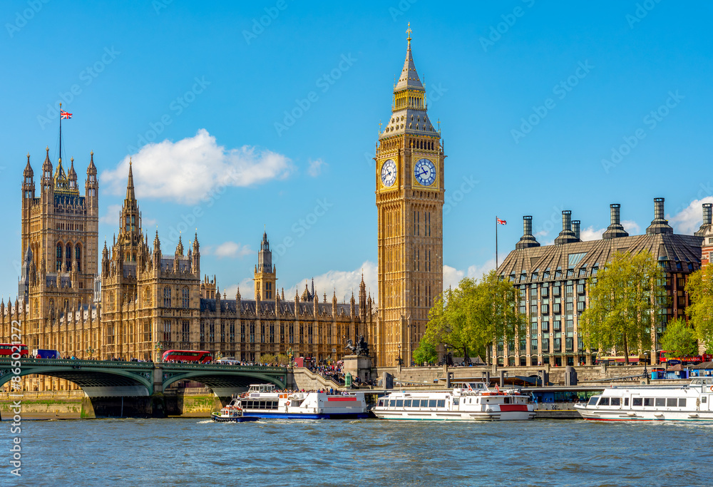 Big Ben tower of Houses of Parliament and Westminster pier, London, UK Big Ben tower of Houses of Parliament and Westminster pier, London, UK