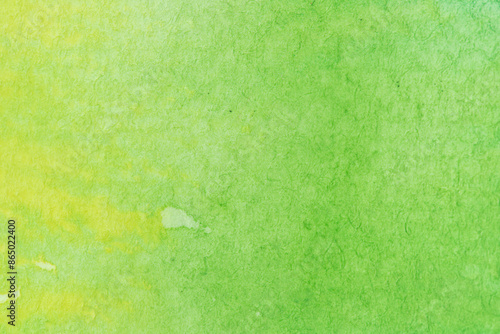 green, yellow watercolor, paint stroke gradient color combination on drawing paper use as background photo