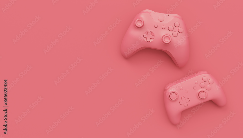 Video game joysticks or gamepads in plain monochrome pink color background Video game joysticks or gamepads in plain monochrome pink color background