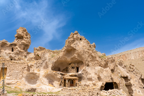 Türkiye Cappadocia Fairy Chimneys as Peri Bacalari. Volcanic rock landcsape of Fairy tale chimneys in Cappadocia with blue sky on background in Goreme, Nevsehir photo