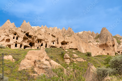 Türkiye Cappadocia Fairy Chimneys as Peri Bacalari. Volcanic rock landcsape of Fairy tale chimneys in Cappadocia with blue sky on background in Goreme, Nevsehir