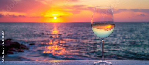 White Wine Against a Summer Sunset Over the Sea