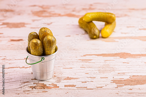 Fotografie Pickles in a Small Bucket on Light Rustic Wood