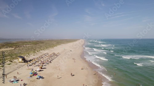 Explore quaint tropical beach of Culatra Island Olhao Portugal with ocean waves crashing along shore