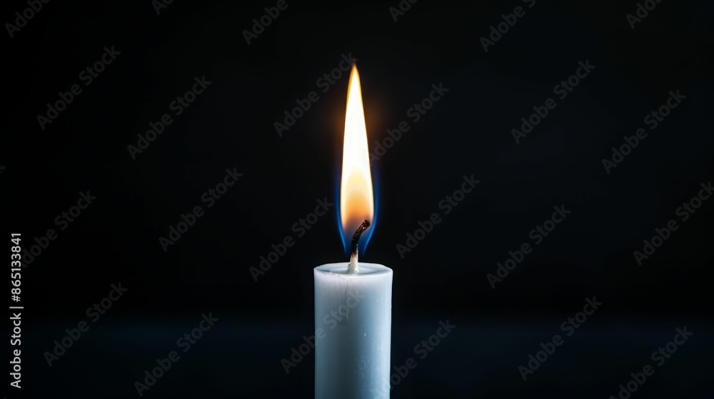 Single Burning Candle on Black Background. Single Burning Candle on Black Background.