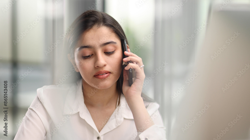 Portrait of young business woman with glasses ofand talking on mobile phone Portrait of young business woman with glasses ofand talking on mobile phone