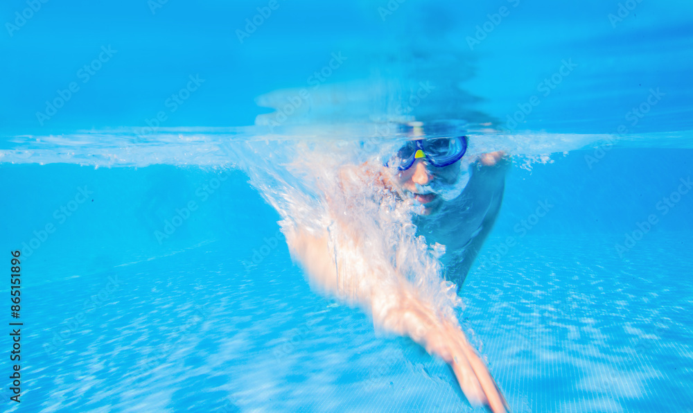 man swims in pool