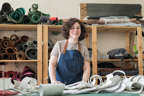 Woman tanner at work in the workshop.  photo