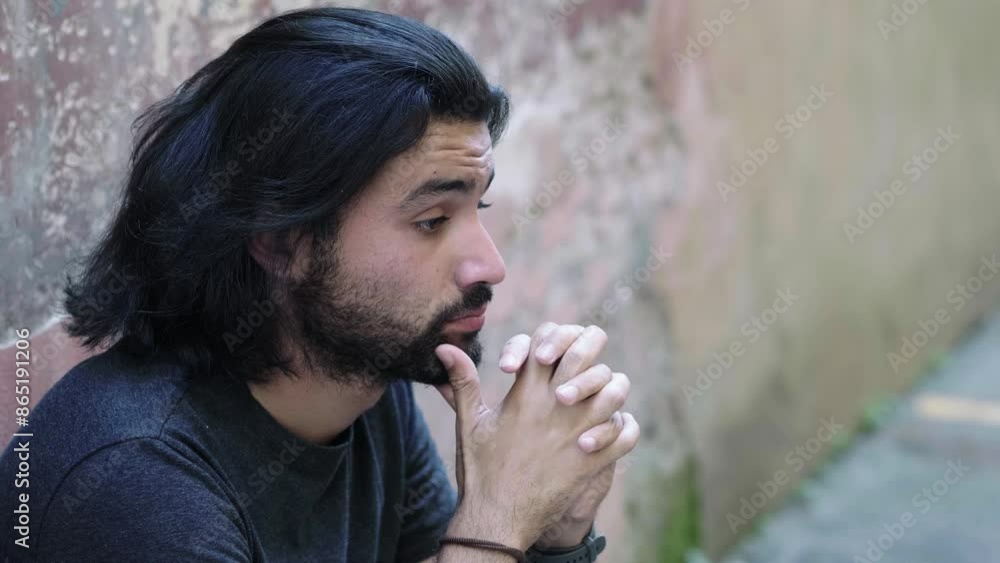 Young man deeply sad after losing a dear friend Young man deeply sad after losing a dear friend