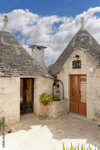 Obraz na płótnie Trulli houses, traditional, unique Apulian dry stone hut with a conical roof, Alberobello, Italy w salonie