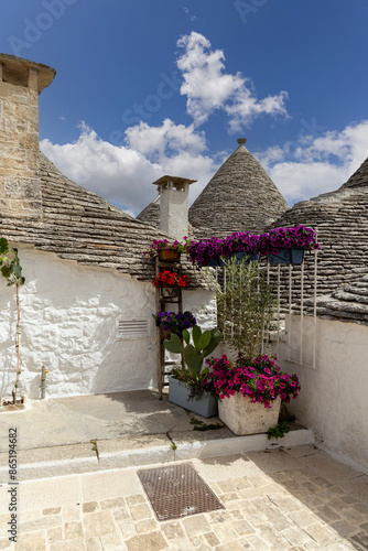 Obraz na płótnie Trulli houses, traditional, unique Apulian dry stone hut with a conical roof, Alberobello, Italy w salonie