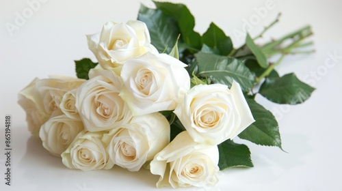 Delicate white roses bouquet on white backdrop for spring occasions