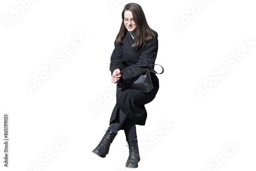 A woman in black coat in sitting pose isolated