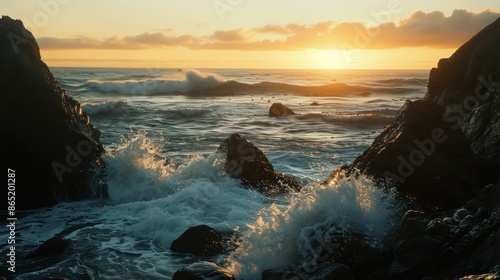 Beautiful sunset over the ocean, waves crashing against the beach and rocks
