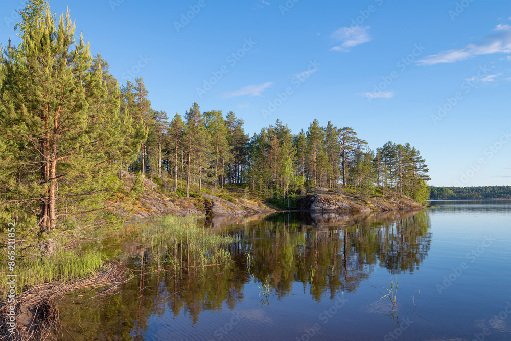 Warm June evening at the Koyonsaari island. Karelia, Russia Warm June evening at the Koyonsaari island. Karelia, Russia