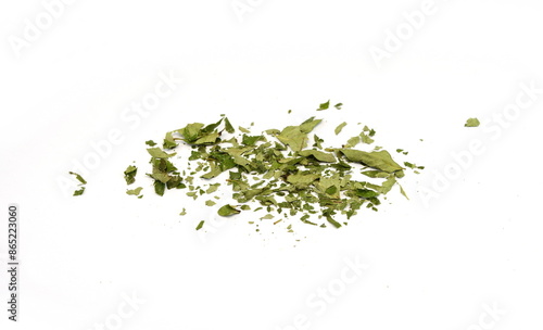 Dried curry leaves isolated on white background. Karivepaku or karuveppilai podi. Karapincha chips. curry leaves chips, coarse cuts.  photo