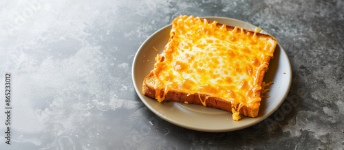 Tasty cheese melted on thin square toast bread easy snack white plate timber kitchen table empty copy space lunch unhealthy quick cheap meal simple breakfast food photo melting cheesy snack dish bite