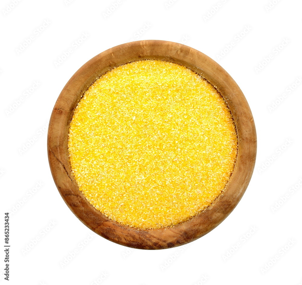 Cornmeal polenta in wooden bowl isolated. Corn polenta, uncooked isolated on white Cornmeal polenta in wooden bowl isolated. Corn polenta, uncooked isolated on white