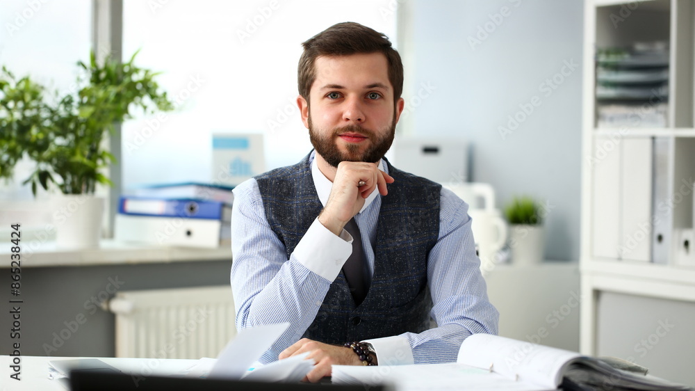 Handsome smiling bearded clerk man at office workplace with silver pen in arms do paperwork portrait. Staff dress code worker job offer client visit study profession boss stock idea coach training Handsome smiling bearded clerk man at office workplace with silver pen in arms do paperwork portrait. Staff dress code worker job offer client visit study profession boss stock idea coach training