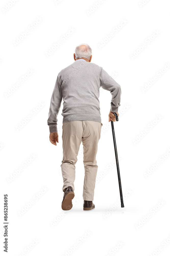 Rear view shot of an elderly man walking with a walking cane Rear view shot of an elderly man walking with a walking cane