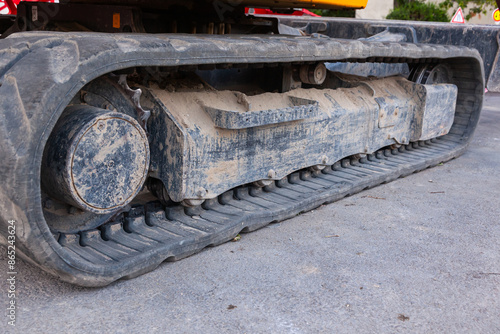 Schilderij op canvas Tracked vehicles with rubber tracks on asphalt.