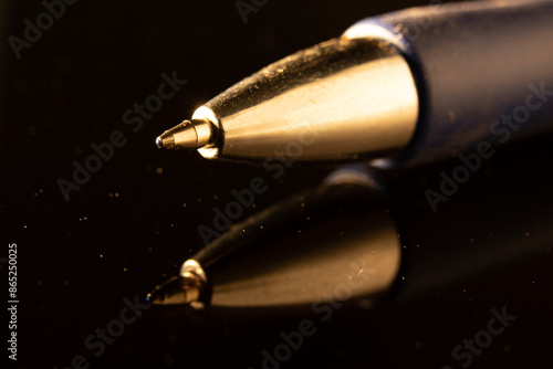 Photograph of a gold pen with visible details Traces of use for a long time