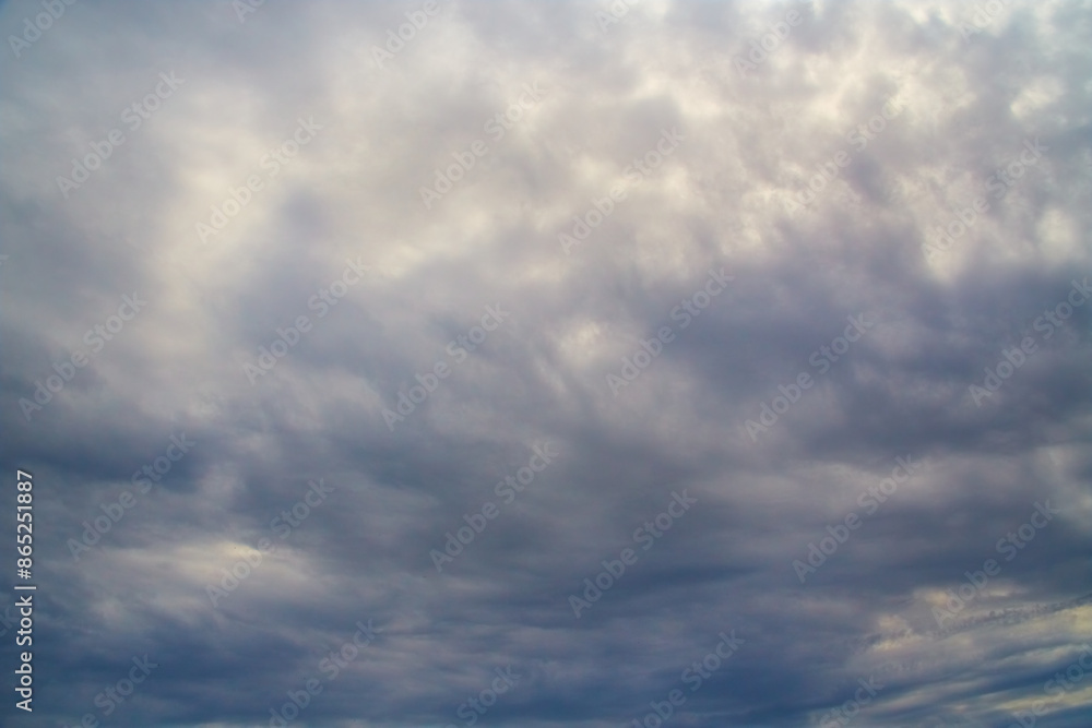 Gray-blue skies and gloomy clouds block out the sunlight, dramatic skies in dark colors Gray-blue skies and gloomy clouds block out the sunlight, dramatic skies in dark colors