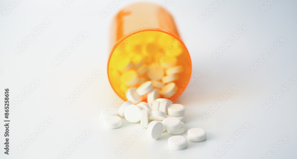 Tablets scattered white color jar on table of pharmaceutical laboratory pill for prescription and treatment various diseases chemistry background closeup Tablets scattered white color jar on table of pharmaceutical laboratory pill for prescription and treatment various diseases chemistry background closeup