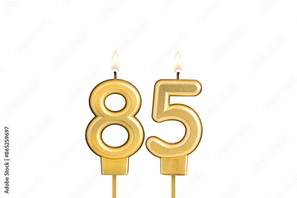 Golden number 85 birthday candle on white background Golden number 85 birthday candle on white background