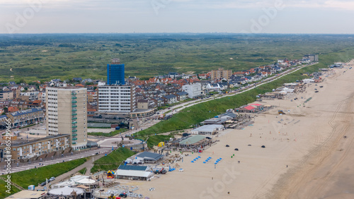 Aerial drone photo of the beach, boulevard and restaurants in the coastal town named Zandvoort in the Netherlands.