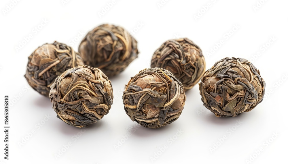 Fototapeta premium Jasmine tea balls on a white background also known as flowering or blooming tea Close up shot