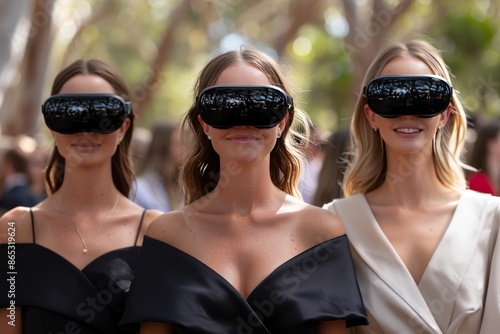 Three Women Wearing Virtual Reality Headsets at an Outdoor Event