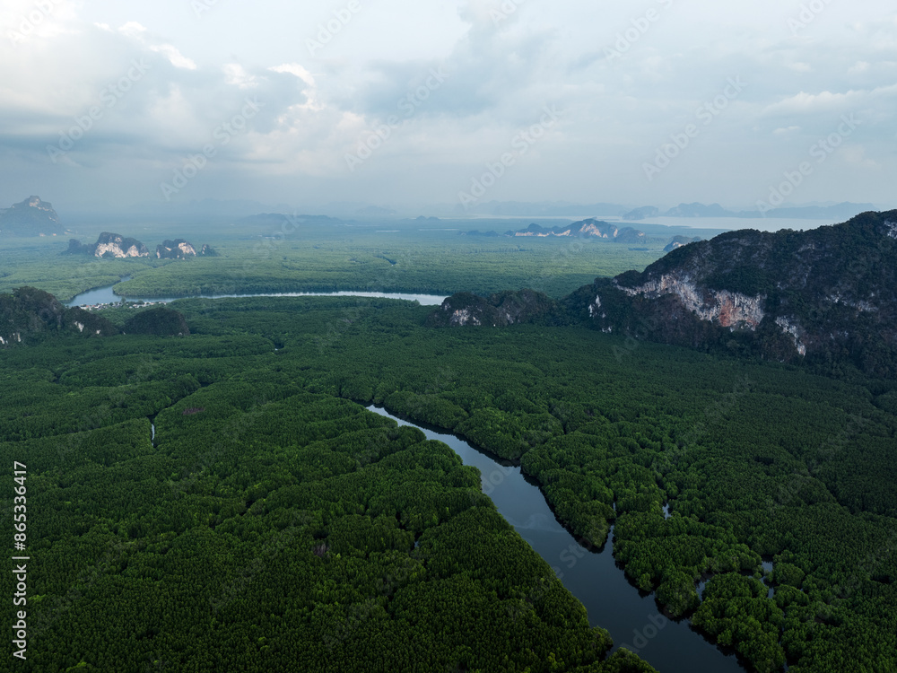View from above, aerial shot, stunning view of Ao Phang Nga (Phang Nga Bay) National Park featuring a multitude of limestone formations rising from the sea. Thailand.