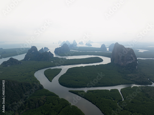 Obraz na płótnie View from above, aerial shot, stunning view of Ao Phang Nga (Phang Nga Bay) National Park featuring a multitude of limestone formations rising from the sea. Thailand. w salonie