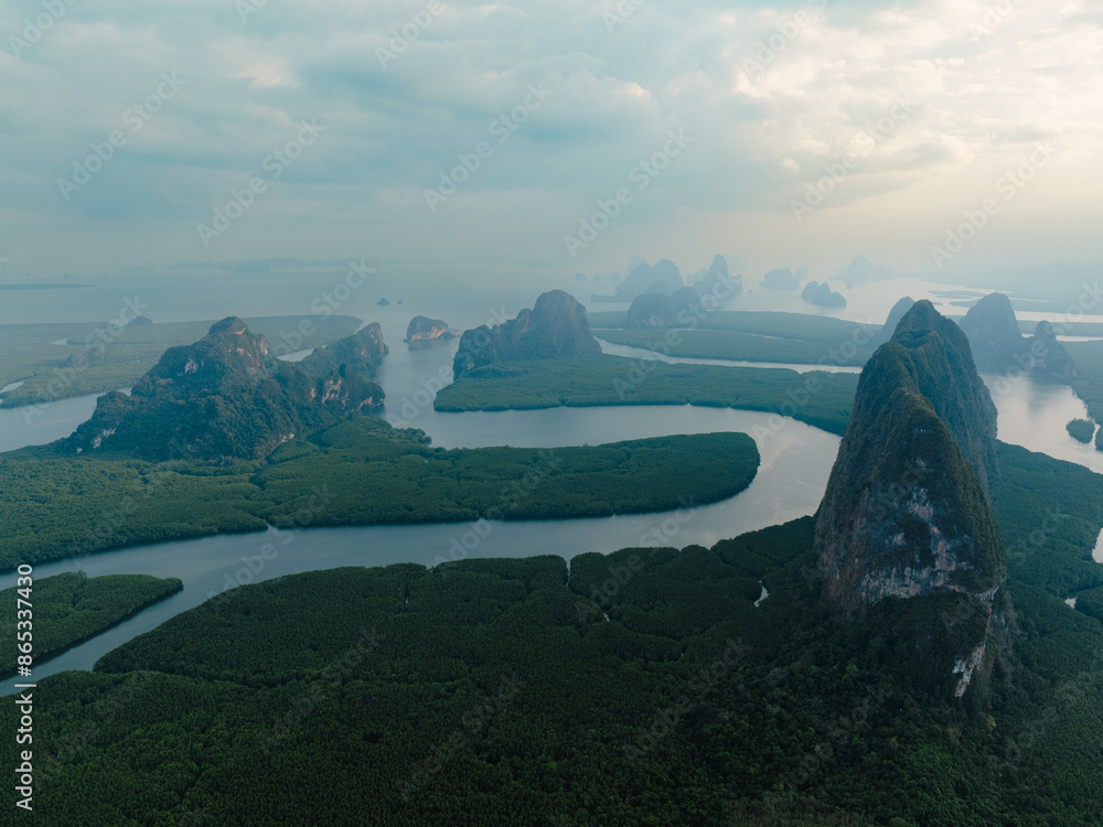 View from above, aerial shot, stunning view of Ao Phang Nga (Phang Nga Bay) National Park featuring a multitude of limestone formations rising from the sea. Thailand.