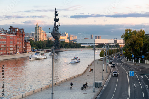 MOSCOW - SEPTEMBER 18, 2022: View of passenger ships on the Moskva River, the Red October confectionery factory, and the monument to Peter the Great from the Patriarchal Bridge
