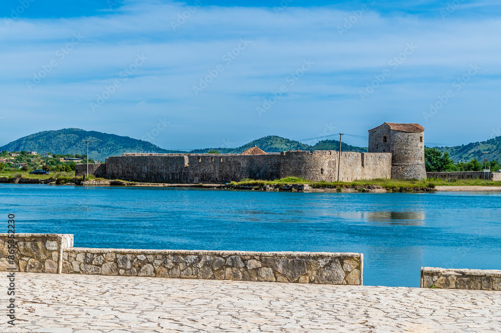 A view across the Straits of Corfu at Butrint towards the Venetian castle in Albania in summertime A view across the Straits of Corfu at Butrint towards the Venetian castle in Albania in summertime