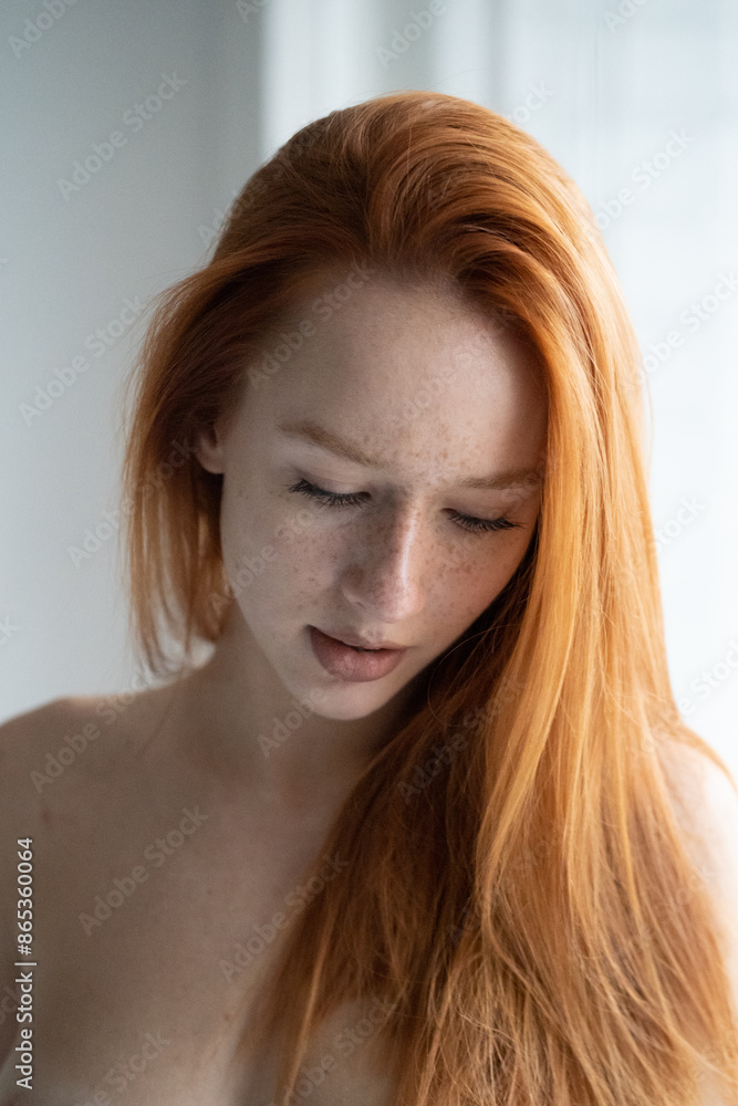 portrait of young beautiful woman with red hair in studio portrait of young beautiful woman with red hair in studio
