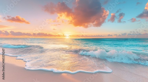 A serene beach scene at sunset with colorful skies and gentle waves lapping the shore