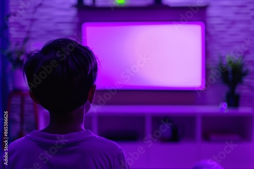 Ui mockup through a shoulder view of a young boy in front of an smart-tv with an entirely purple screen