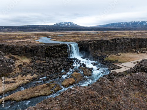 Aerial panorama of Oxarafoss waterfalls in Thingvellir National Park, Iceland, featuring the scenic Oxara River and the unique landscape created by the tectonic plates of America and Eurasia. photo