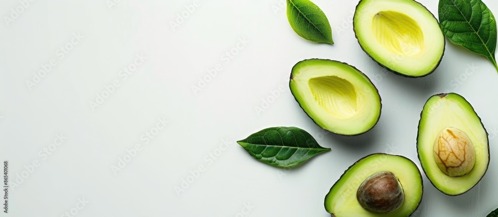 Avocado with avocado leaf on a white backdrop. Avocado with avocado leaf on a white backdrop.